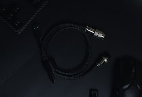 Gaming Accessories - a close up of a cord and a mouse on a table