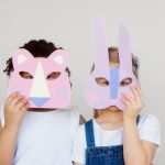 Innovative Design - Two Kids Covering Their Faces With a Cutout Animal Mask