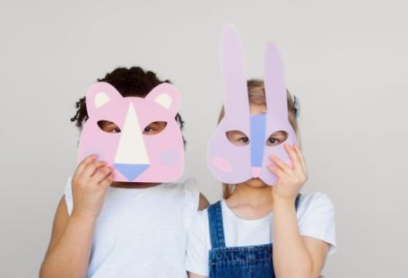 Innovative Design - Two Kids Covering Their Faces With a Cutout Animal Mask