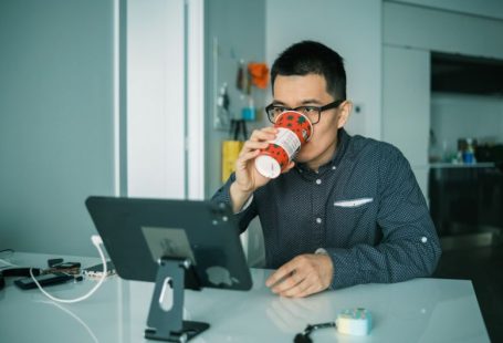 Retrofit Monitor - man in black and white checkered dress shirt drinking from brown and white ceramic mug