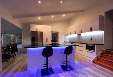 LED Lighting - black and purple chairs on brown wooden floor