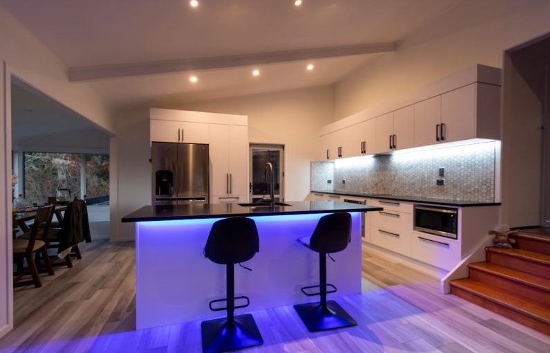 LED Lighting - black and purple chairs on brown wooden floor