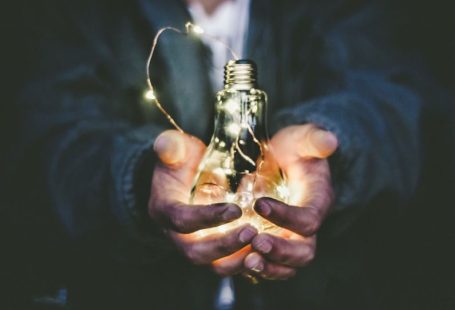 Energy-efficient - man holding incandescent bulb