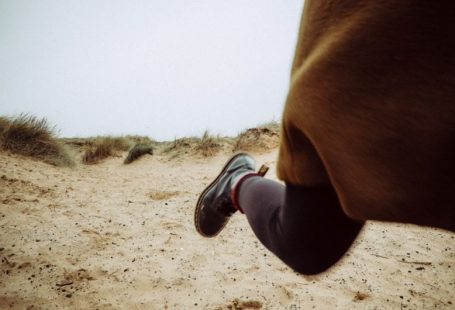 Fast Boot - person walking on sandy ground