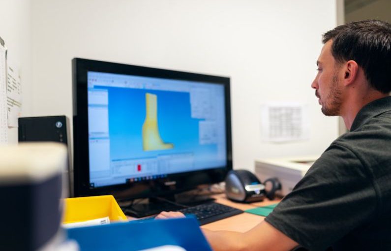 Monitoring Tools - man in black t-shirt sitting in front of computer