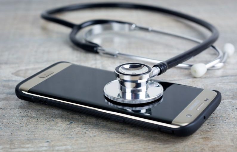Troubleshooting - a smart phone with a stethoscope on top of it