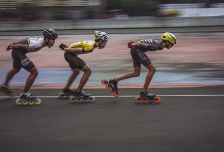 High-speed Internet - man in blue tank top and yellow helmet riding on orange and black motorcycle