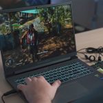 PC Lifespan - a person playing a video game on a laptop