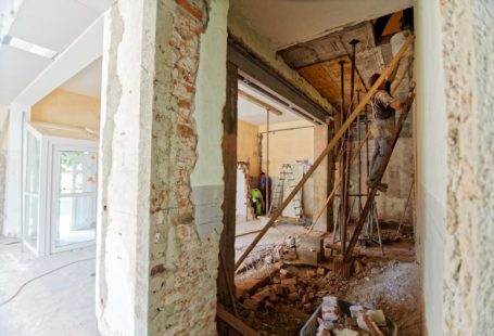 Firmware Update - man climbing on ladder inside room