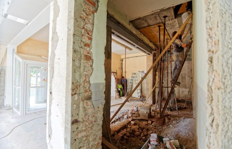 Firmware Update - man climbing on ladder inside room