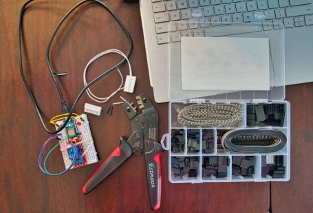 IoT Connectivity - red and silver scissors beside white laptop computer