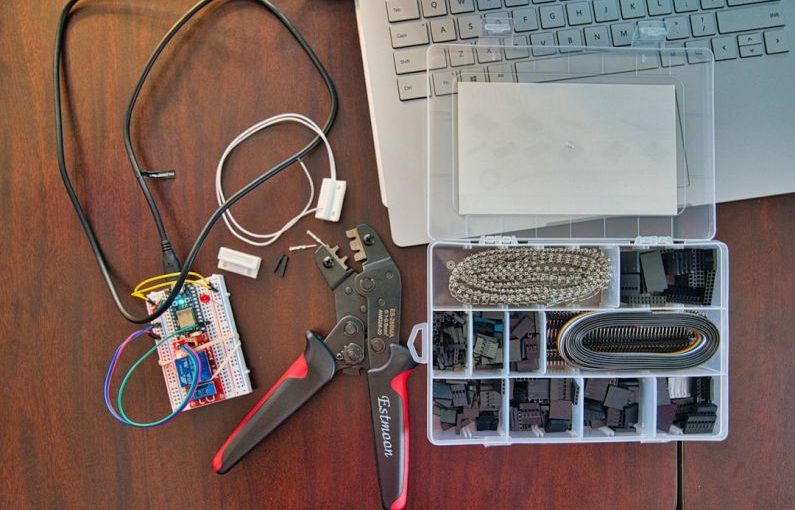 IoT Connectivity - red and silver scissors beside white laptop computer